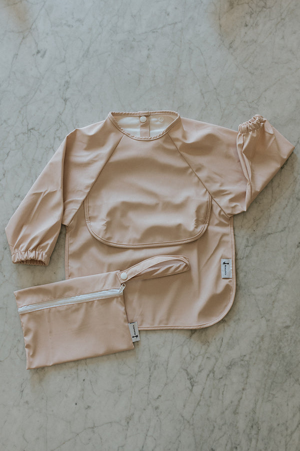 Bavette à manches longues avec pochette intégrée