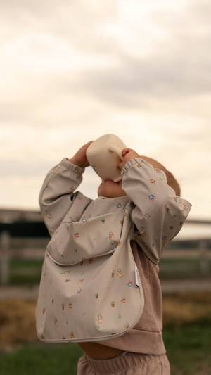 Bavette à manches longues avec pochette intégrée