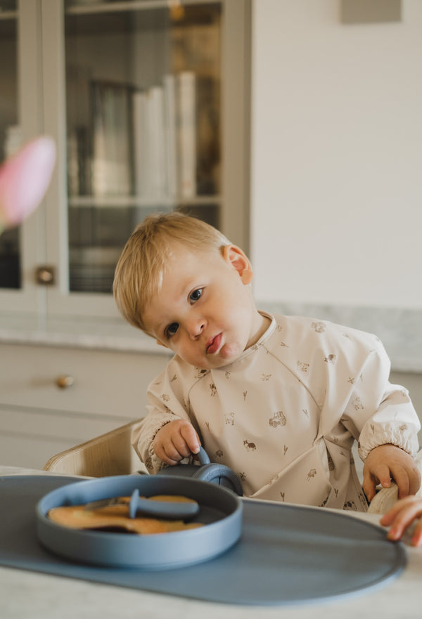 Bavette à manches longues avec pochette intégrée