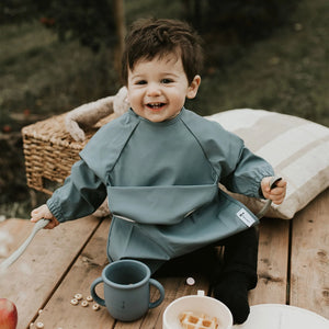 Bavette à manches longues avec pochette intégrée