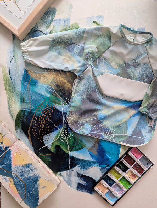 Bavette à manches longues avec pochette intégrée