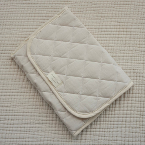 tapis de change crème