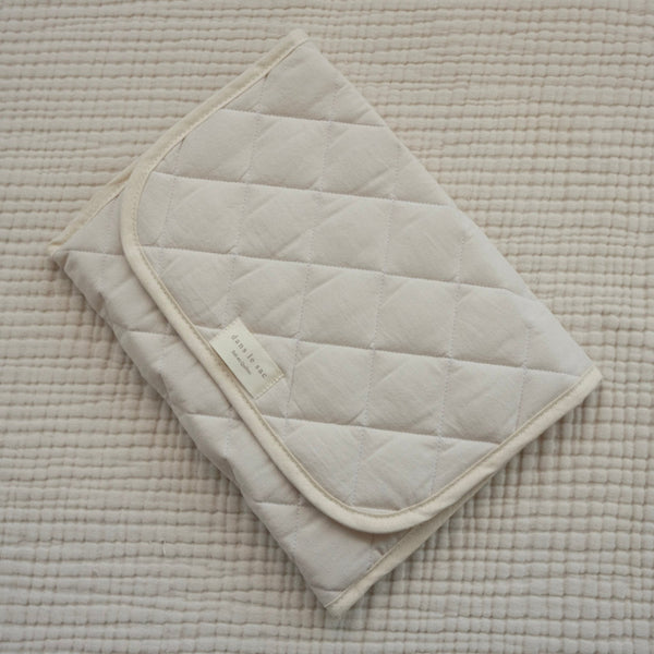 tapis de change crème